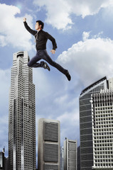 Fototapeta na wymiar man flying in the sky over buildings