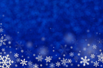 Christmas decoration with snowflakes on defocused blue background.