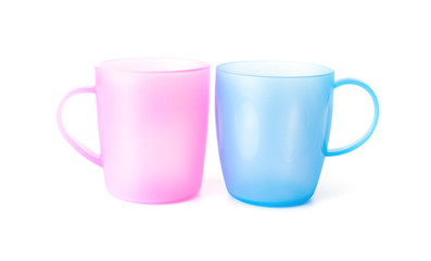pink and blue plastic cups on a white background