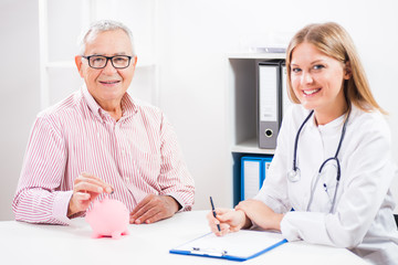 Happy patient is saving money for his medical treatment.