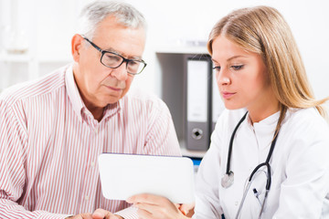 Doctor is showing medical test results to her patient.