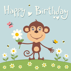 Happy birthday! Cute monkey with flower on meadow. Birthday card.