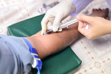 Nurse taking a blood sample for test the health