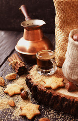 Turkish coffee in a small cup, cookies, selective focus