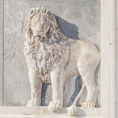 Marble lion on church facade