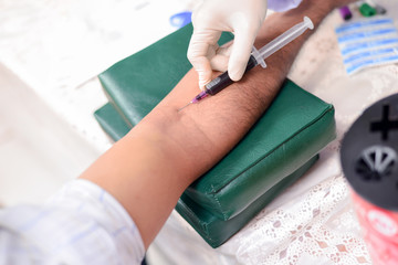 Nurse taking a blood sample for test the health