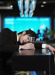 man relaxing at bar