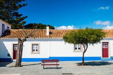 Traditional blue and white Alentejo Portuguese buildings in Porto Covo, Portugal
