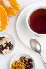 a mug of tea, oranges and brown sugar