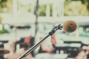 Close up of microphone blurred background.