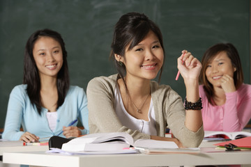 Three women in classroom.