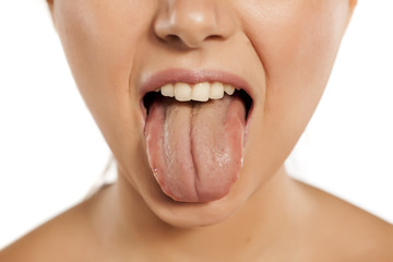 young woman stick out her tongue