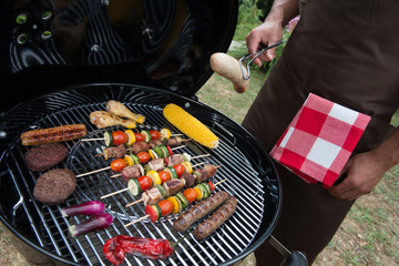 Assorted delicious grilled meat with vegetable on a barbecue