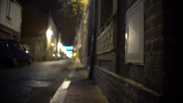 POV of person hiding in dark alley, planning to commit a crime, robbery, theft