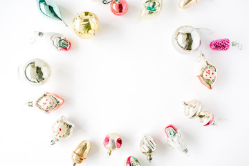 creative arrangement frame of bright christmas balls and toys on white background. flat lay, top view