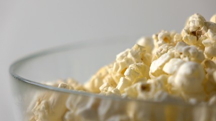 Popcorn in a glass bowl close-up