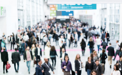 blurred business people trade fair stock photo