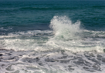 Splash of water in sea.
