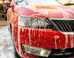 Car covered with foam, car wash..
