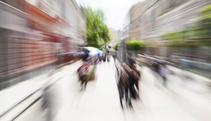 Fototapeten pedestrian street motion zoom blurred background © VILevi