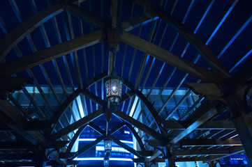 wooden structure in the shape of an arch and lights at night