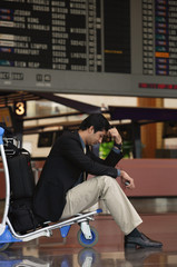 Man waiting in departure lounge at airport