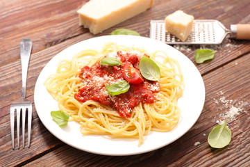 spaghetti with tomato sauce and parmesan