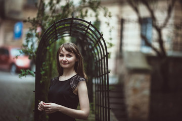 beautiful young girl standing on the street