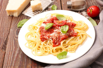spaghetti with tomato sauce and parmesan