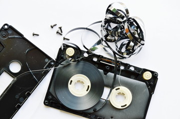 audio cassette tape dismantling parts on white background