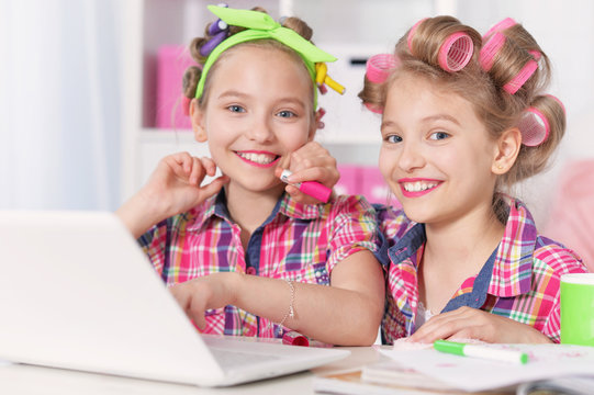 Cute  tweenie girls  with laptop