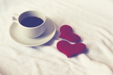 Cup coffee of heart love on white towel floor drink coffee in love