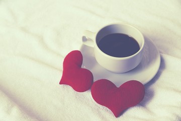 Cup coffee of heart love on white towel floor drink coffee in love