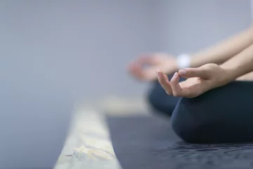 Foto op Canvas Woman Doing Yoga Exercises In Gym, Closeup Sport Fitness Girl Sitting Lotus Pose Meditation Relaxation © mast3r