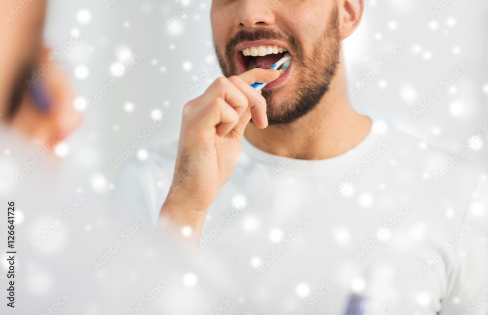 Poster close up of man with toothbrush cleaning teeth