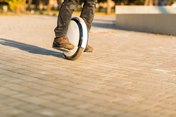 Man legs mono wheel personal electrical transport street outdoor © mast3r