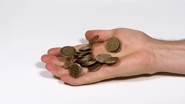 Hand of Man Falling with Euro Coins against White Background, Slow Motion