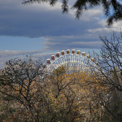 Fototapeta premium Ferris wheel in Tbilisi on bright blue sky background