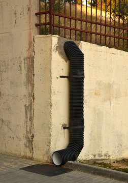 Black corrugated pipe for protection of territory from flowing down from mountain rain water in place of differential level of urban landscape