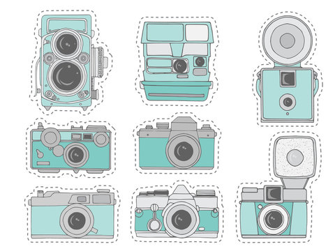 Colorful retro camera set. Hand drawn vintage photocameras set with cute patterns. Vector illustration. Cute retro camera stickers in cartoon style