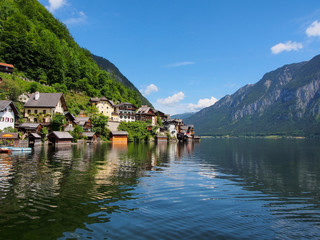 Fototapeta na wymiar Hallstatt village and alpine lake in sunny day. Austrian Alps