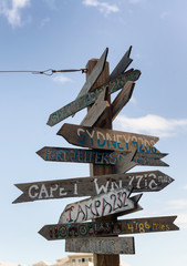 Rustic wooden signpost to various destinations at Fort Zachary,