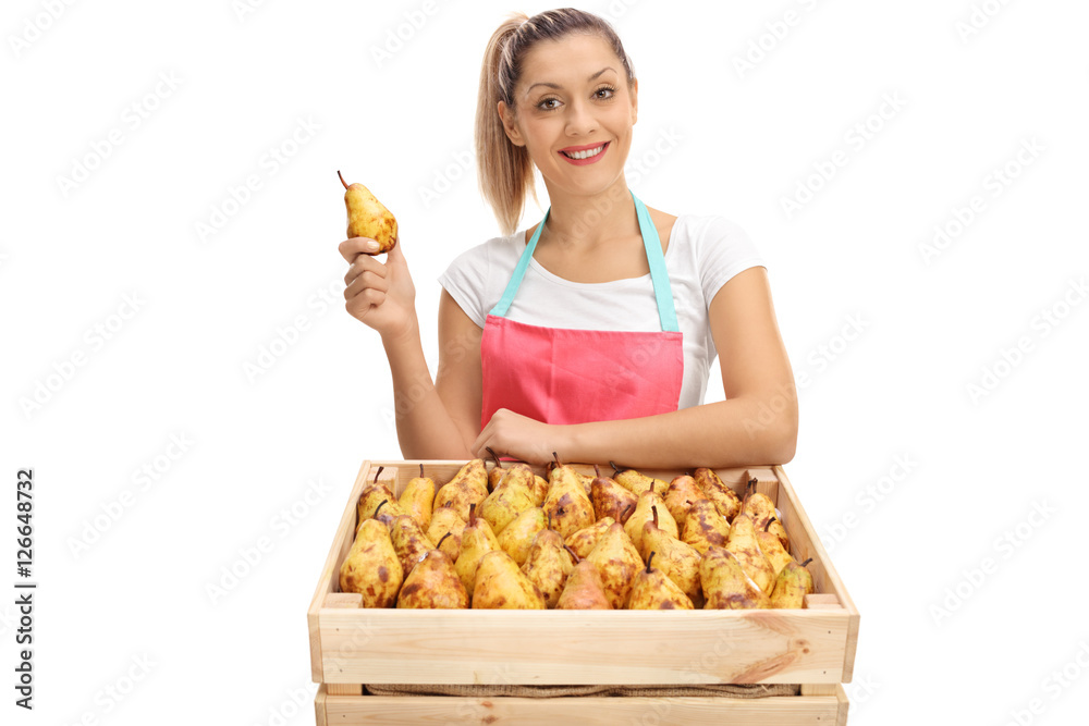 Wall mural female vendor behind a crate full of pears