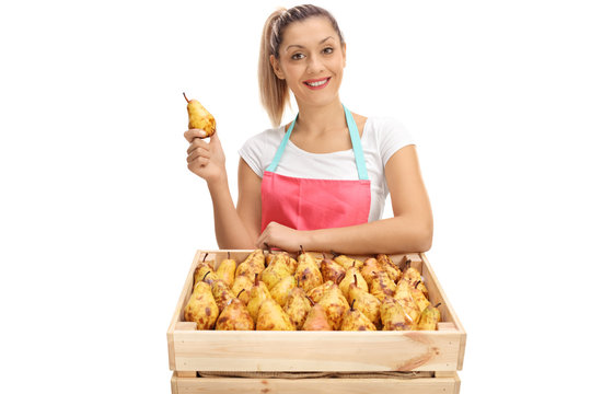 Female Vendor Behind A Crate Full Of Pears