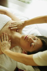 Fototapeta na wymiar Young woman being massaged