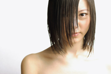 Fototapeta premium Young woman with wet hair, head shot