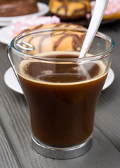 cup of hot coffee on black