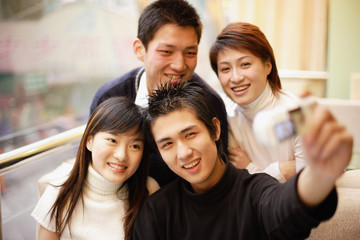 Young adults posing for photograph