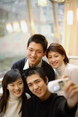 Young adults taking photograph of themselves