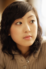 Fototapeta premium Young woman, looking away, portrait